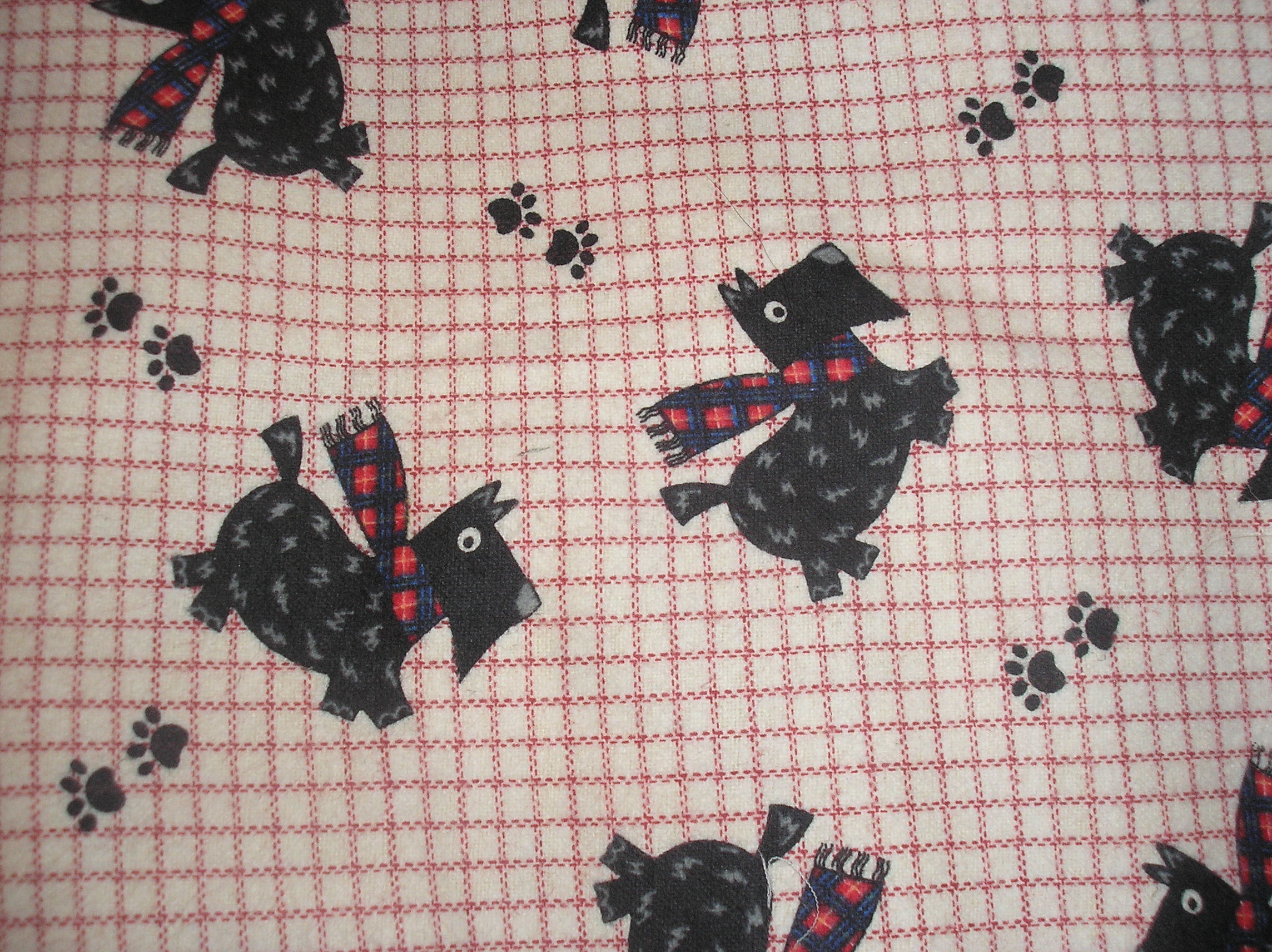 Scotties on white background available with blue or red lines in design. 